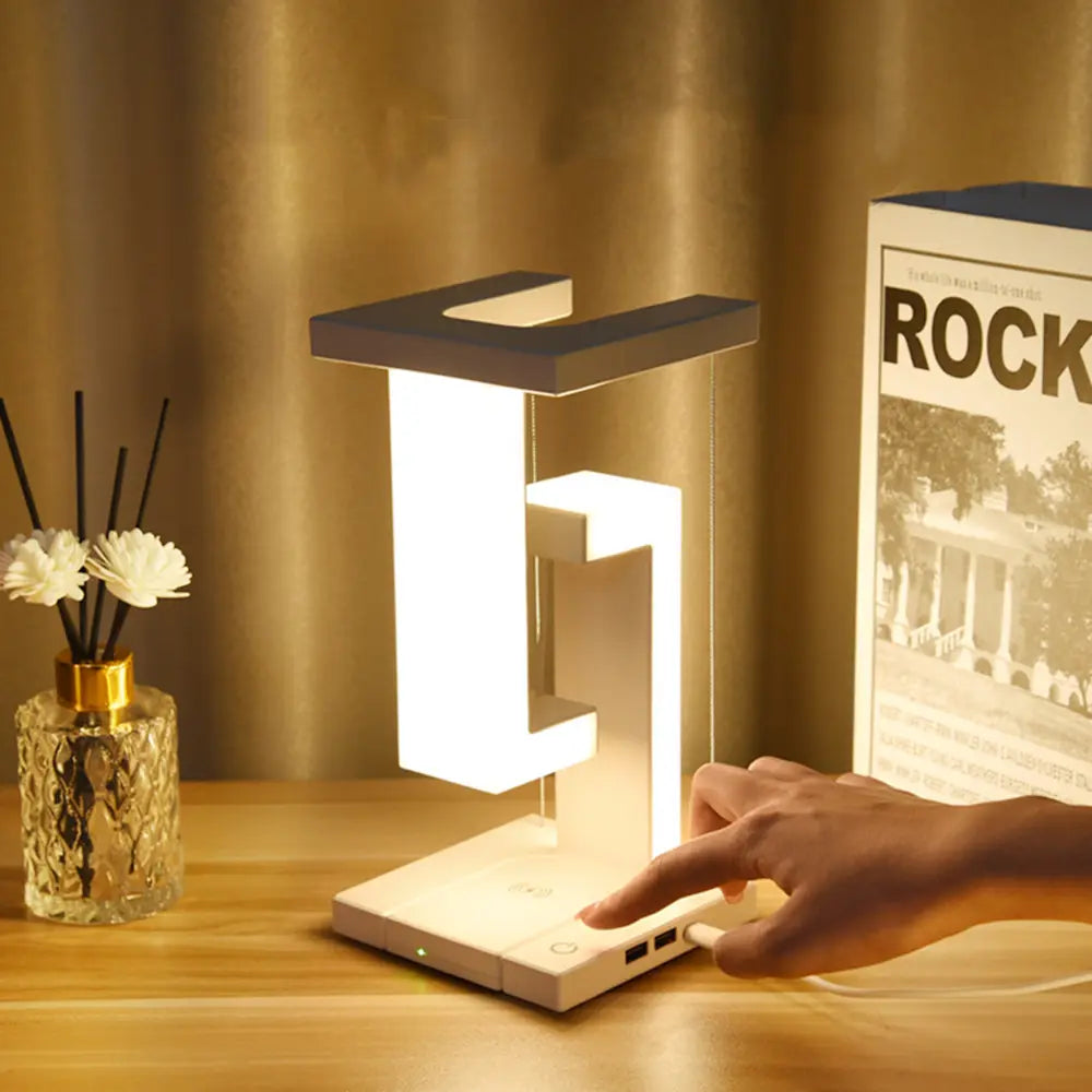 AetherGlow minimalist LED desk lamp with wireless charging, perfect for modern home office decor. Sleek design.