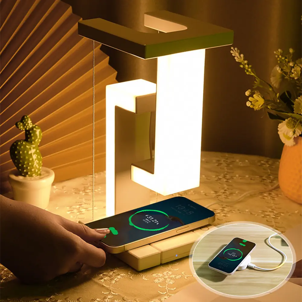 Modern AetherGlow desk lamp in black with an integrated wireless charger, illuminating a stylish workspace.