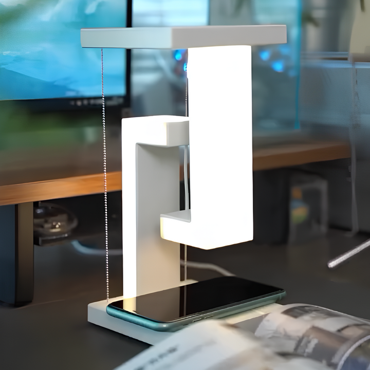 A white AetherGlow LED desk lamp providing warm light, acting as both a night light and charging station.