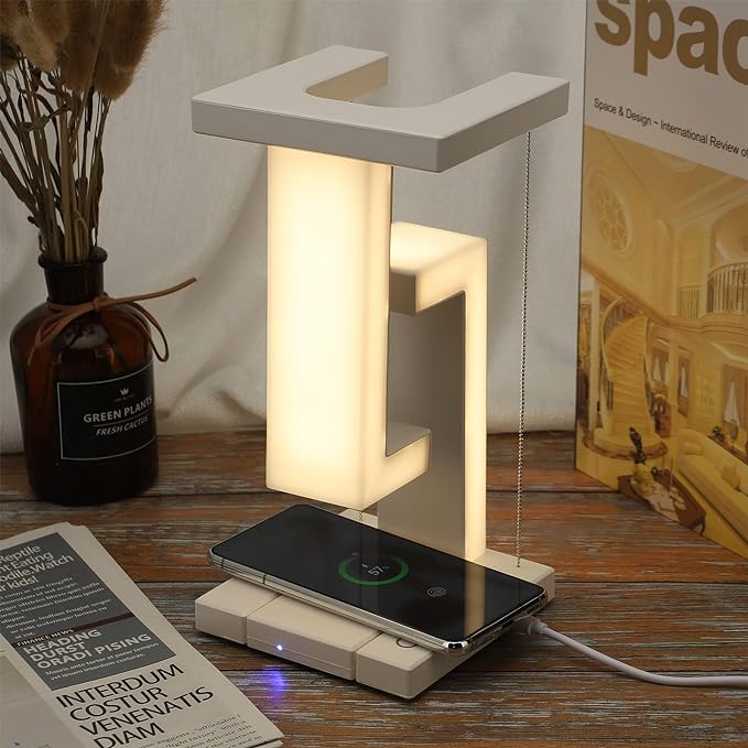 AetherGlow lamp illuminating a book on a nightstand, showcasing its versatility as a modern night light.