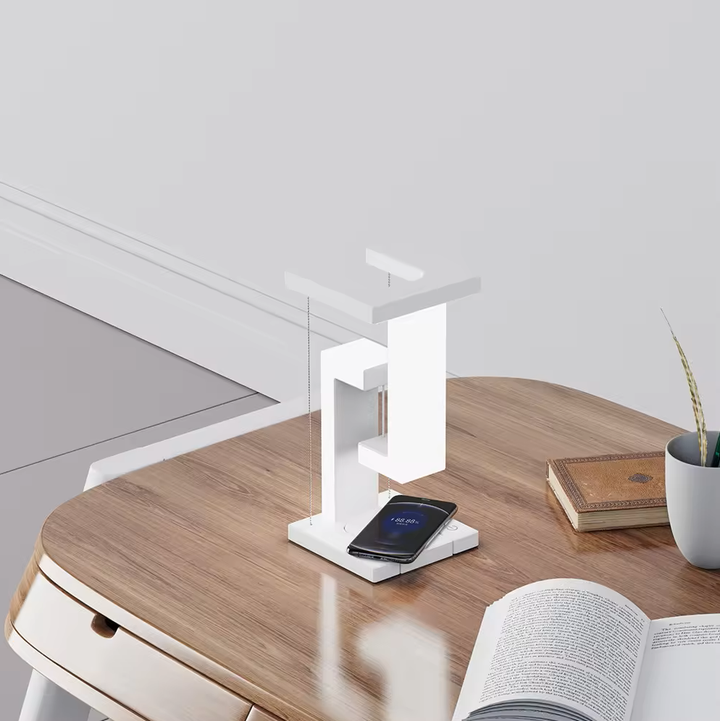 AetherGlow desk lamp in a contemporary office setting, doubling as a wireless charger and essential accessory.