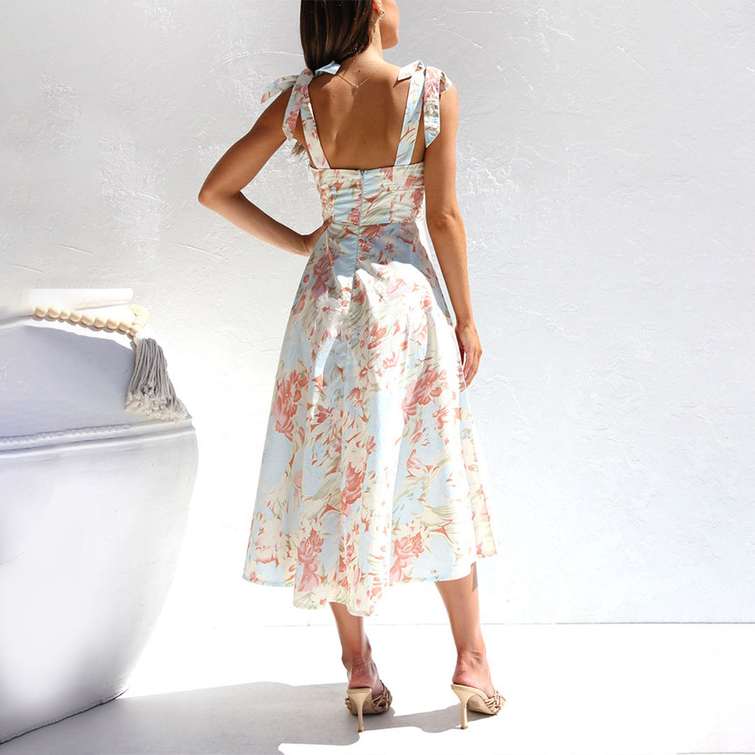 Close-up of lightweight floral midi dress fabric, showing vibrant print and soft texture