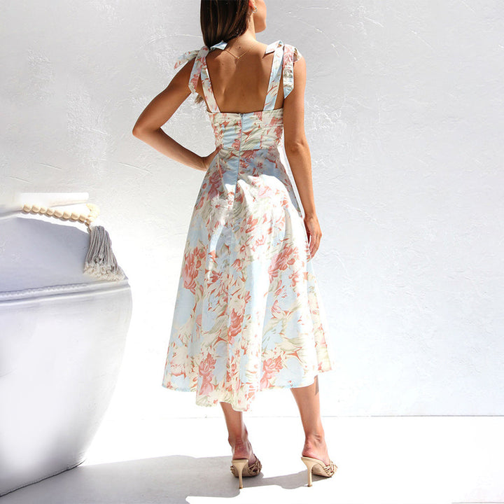 Close-up of lightweight floral midi dress fabric, showing vibrant print and soft texture
