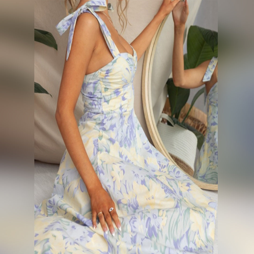 Back view of women's sleeveless floral midi dress, highlighting its comfortable, casual fit