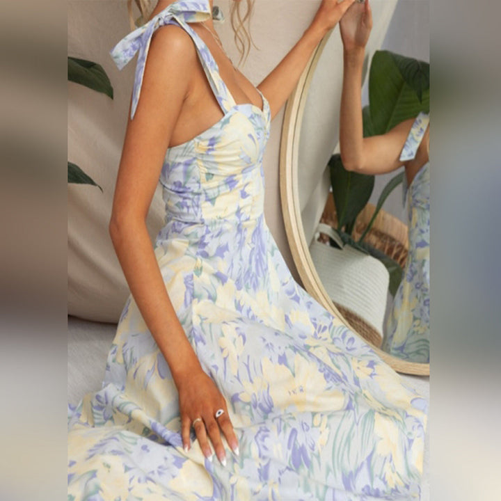 Back view of women's sleeveless floral midi dress, highlighting its comfortable, casual fit