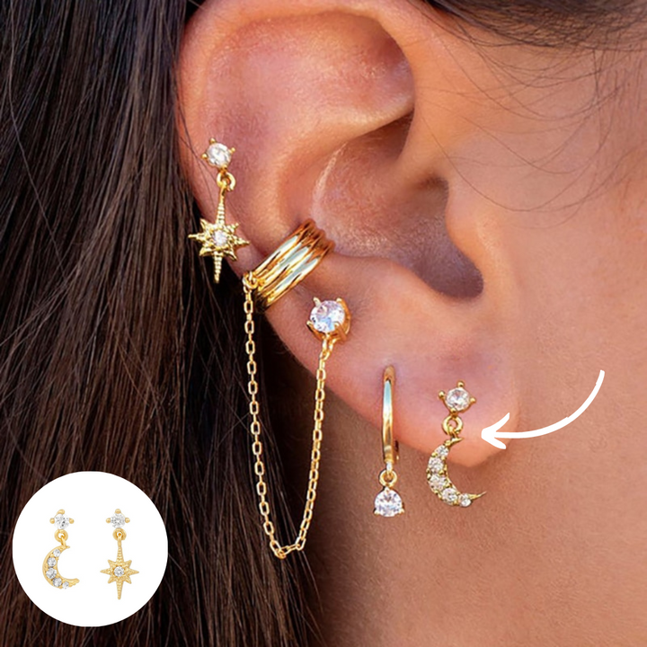Close-up of Amira Boho Chic earring set, showcasing gold hoops, silver studs, and a chain cuff