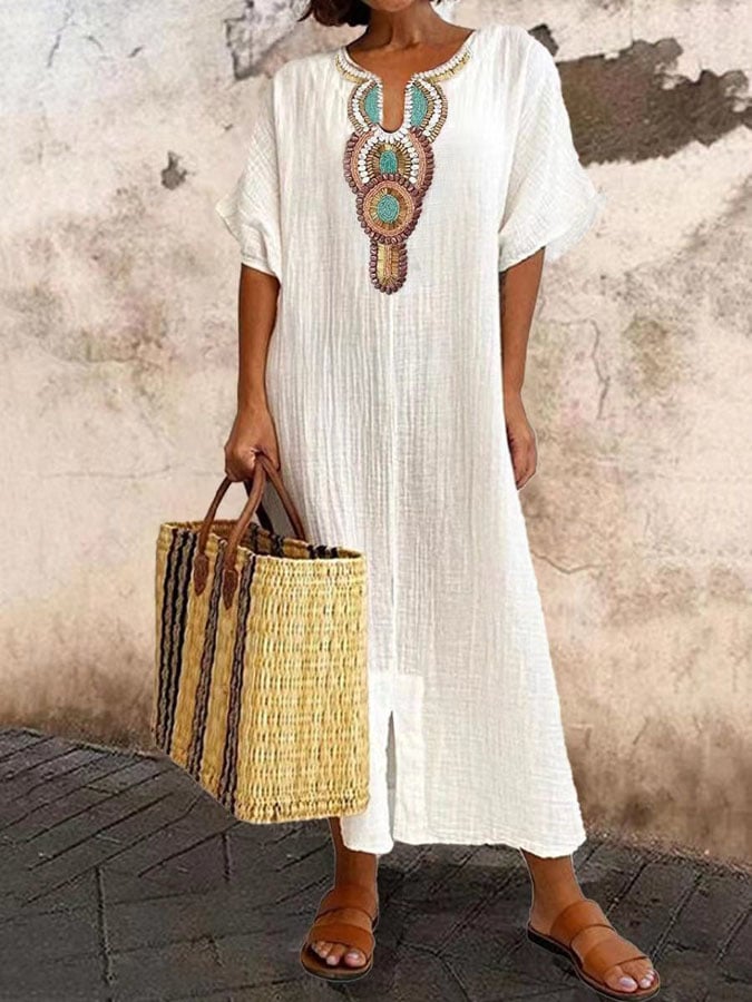 Amira women's strappy loose fit maxi summer dress in white, perfect for vacations, made from lightweight fabric.