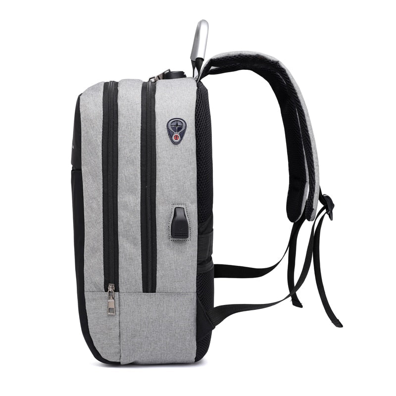Person wearing a gray SafeCarry anti-theft commuter backpack, highlighting its slim profile and security.