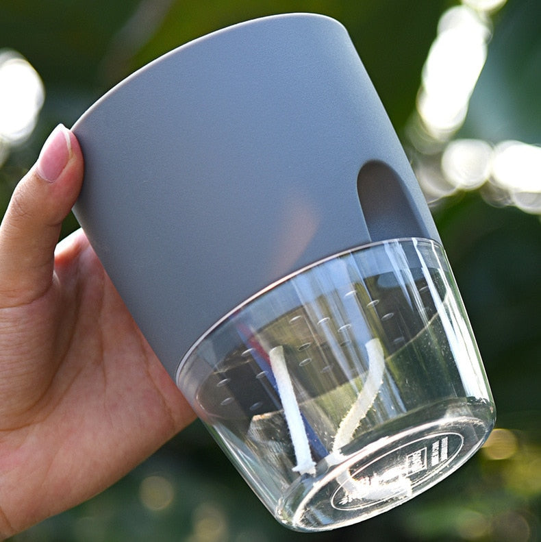 Modern AquaBloom self-watering planter for lush flowers and herbs, ideal for any home decor style.