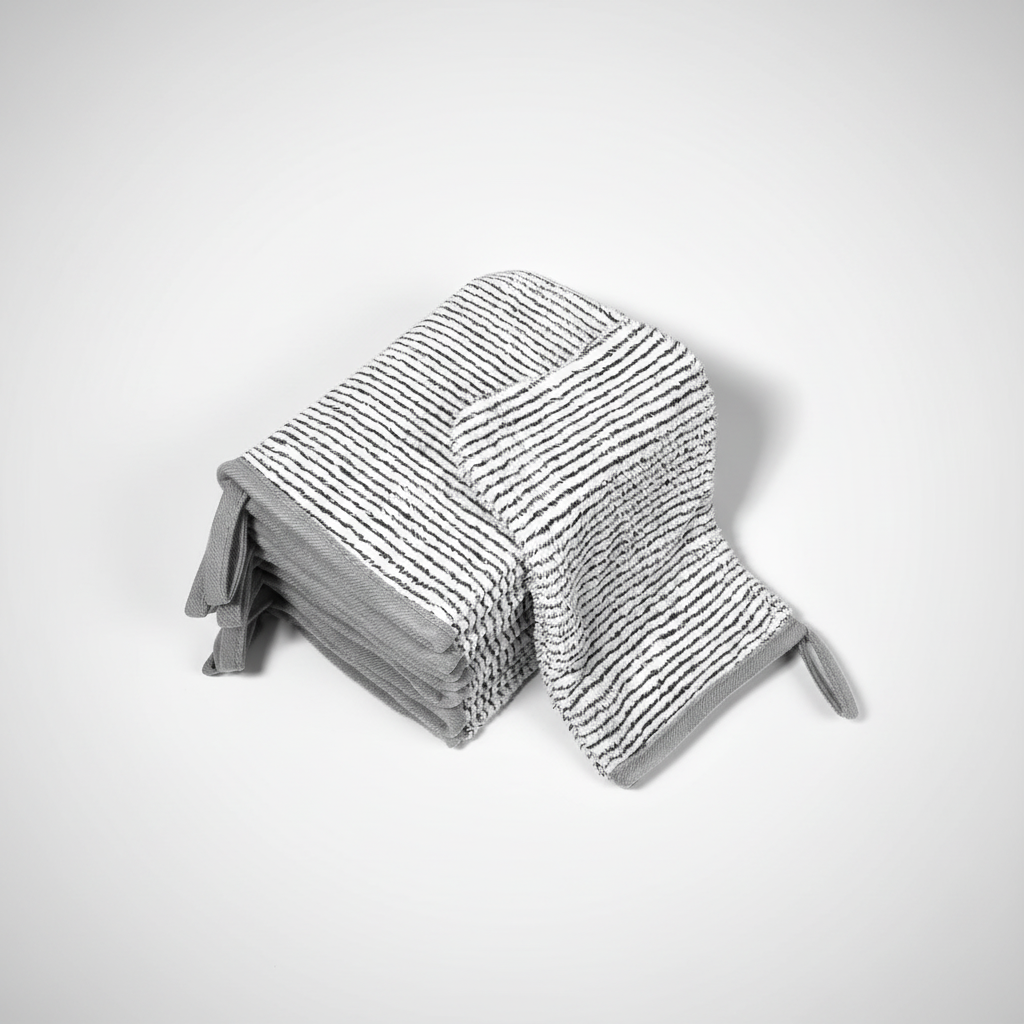 Six neatly stacked AquaJoy coral fleece wash mitts, emphasizing the set for skincare