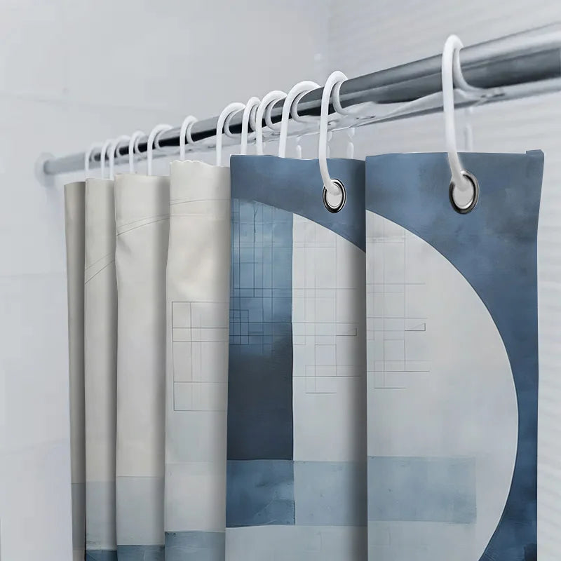 Durable AquaLoom water-repellent shower curtain with a striking blue geometric print, a bathroom essential.