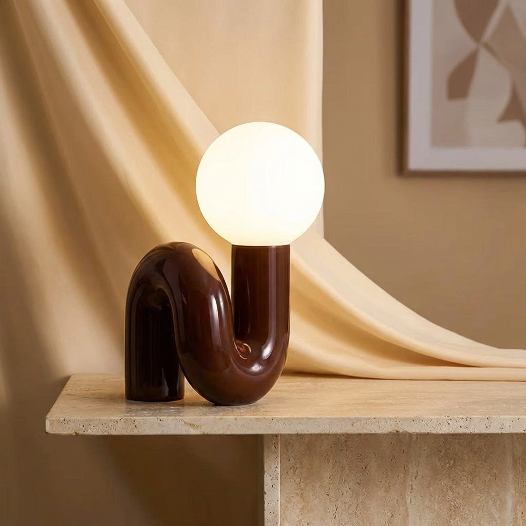 Arcavita LED table lamp with sculptural design, frosted glass for modern home decor.