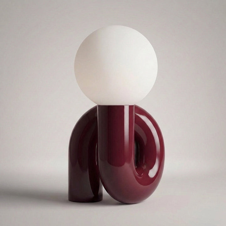 Arcavita table lamp, art-inspired design, provides soft ambient light.