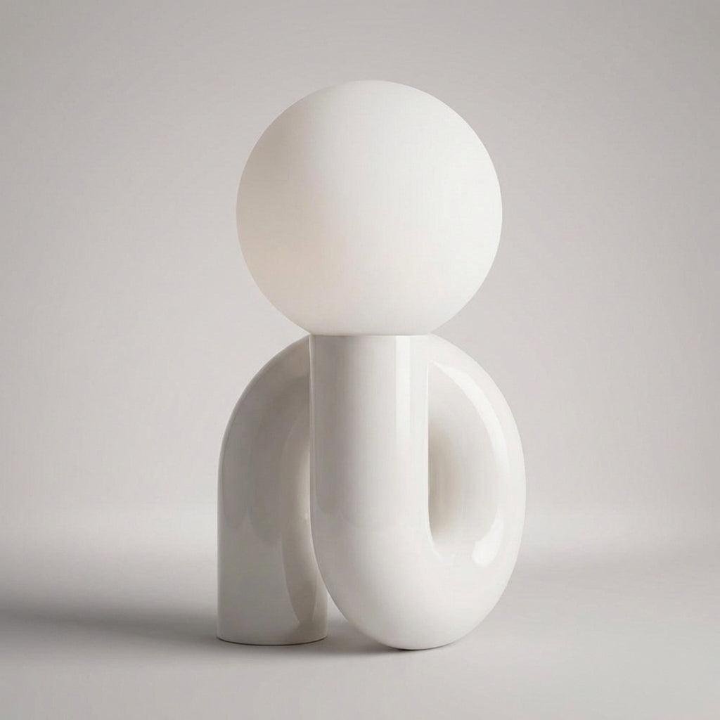 Stylish Arcavita sculptural table lamp with frosted globe, modern lighting solution.