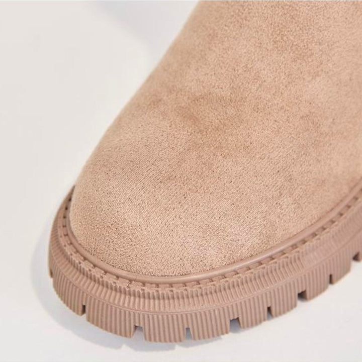 Cozy Aria women's winter boots, waterproof and durable, keeping feet warm & dry in snow.