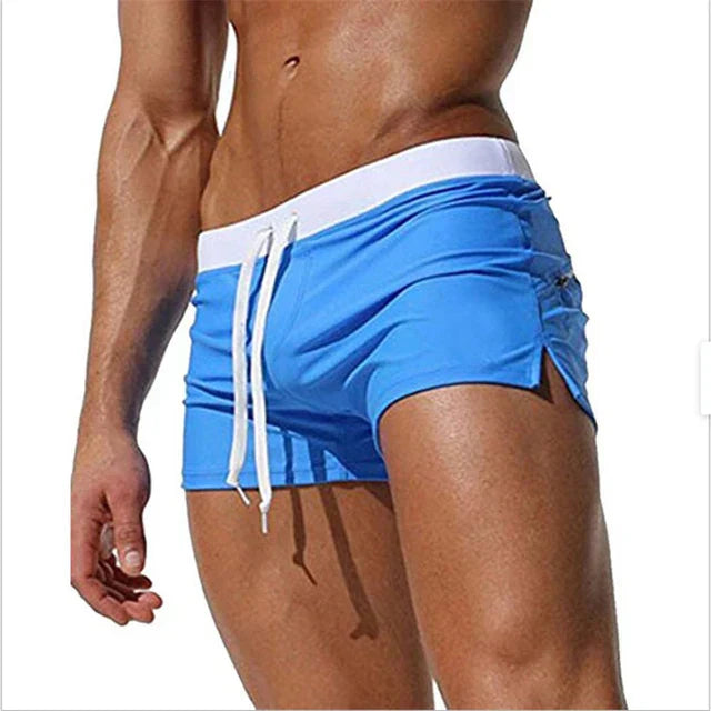 Arlan men's quick-drying swim shorts drying on a clothesline, showcasing fast drying feature