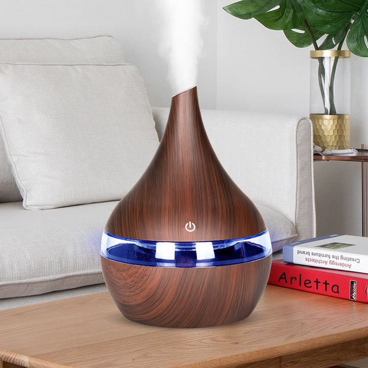 AromaGlow home diffuser humidifier with 7-color LED light for relaxation & improved air quality.