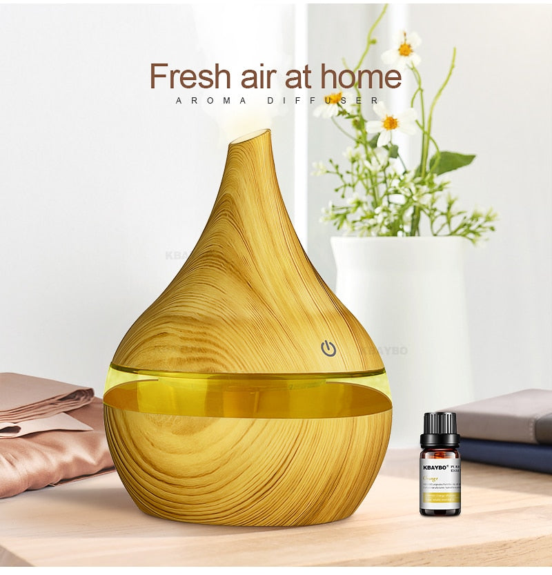 Stylish AromaGlow essential oil diffuser & humidifier with mood lighting, perfect home decor.
