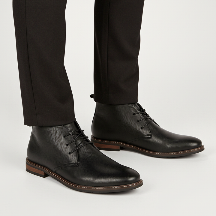 Man wearing Arthur Men's Classic Leather Desert Boots with jeans, showcasing versatile style