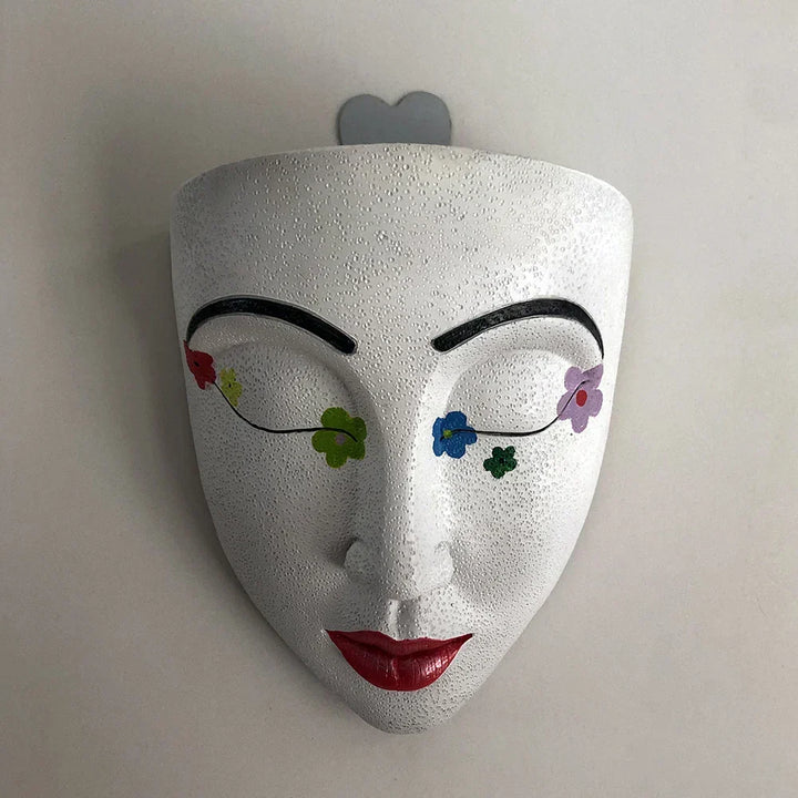 Stylish human face hanging planter for wall decor. Decorative indoor plant holder & modern art statement piece.