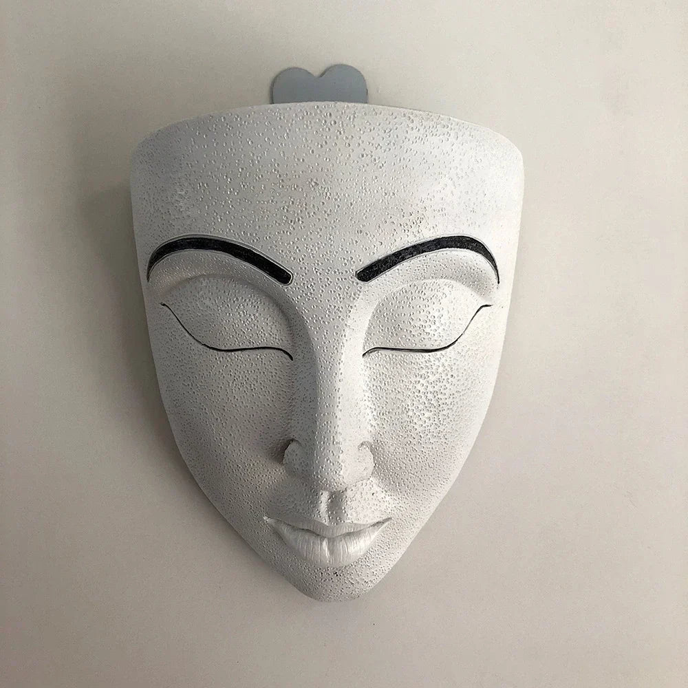 Elegant human face wall planter, resin art for plants. Unique modern decor to elevate your home with greenery.