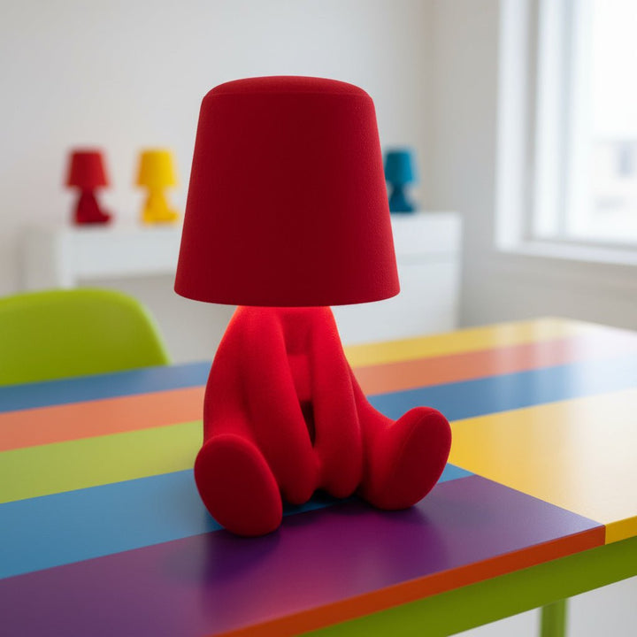 Stylized human figure LED desk lamp. Artistic modern decor, providing soft ambient room lighting.