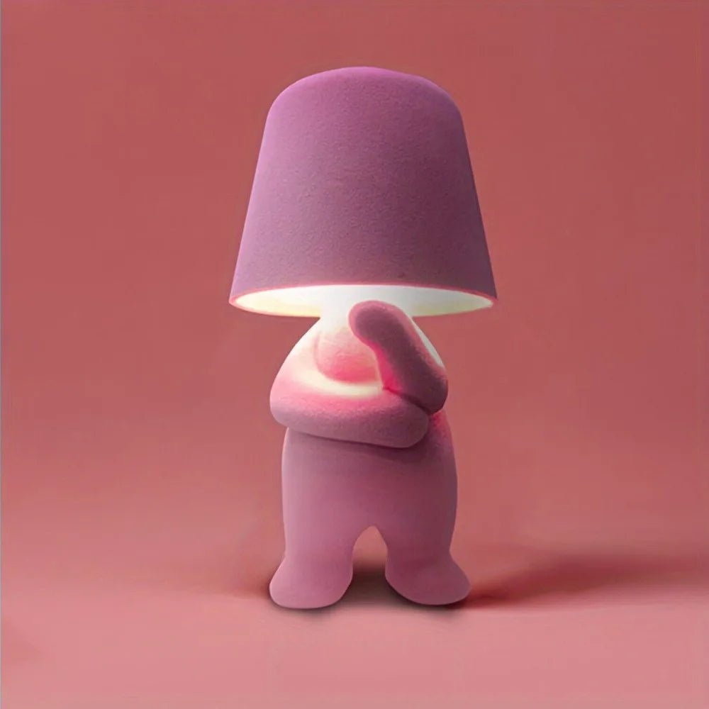 Artistic human figure LED desk lamp. Rechargeable modern table lamp for elegant room lighting.