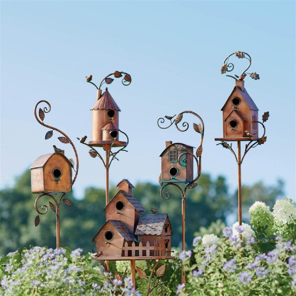 Artistic metal birdhouse garden stake, charming outdoor decor for wildlife & rustic gardens.
