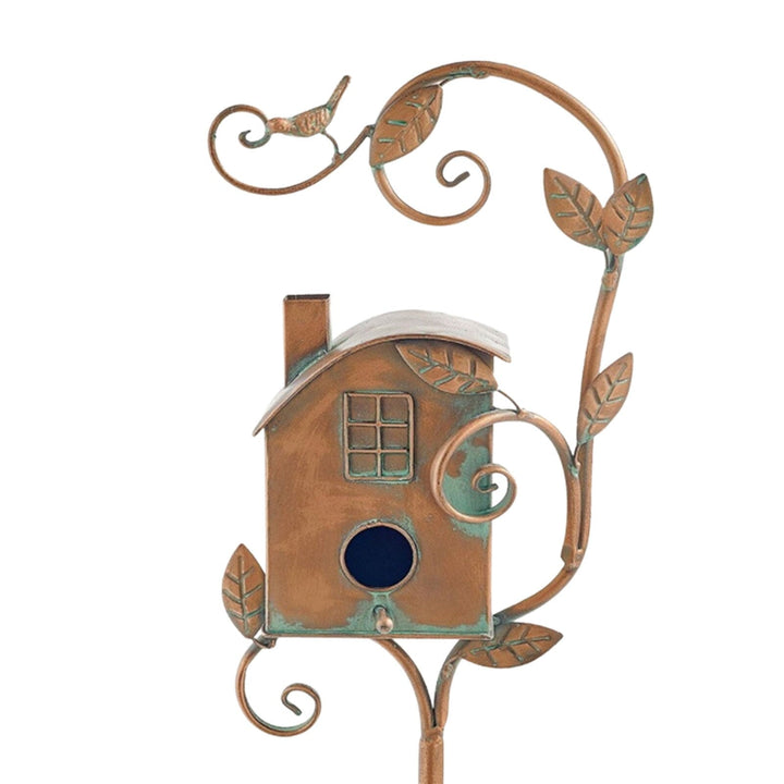 Sculptural metal birdhouse garden stake, beautiful artistic outdoor decor for garden enthusiasts.