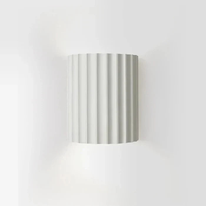 Artistic modern wall sconce, a vibrant decorative light. Perfect accent lighting for contemporary home decor.