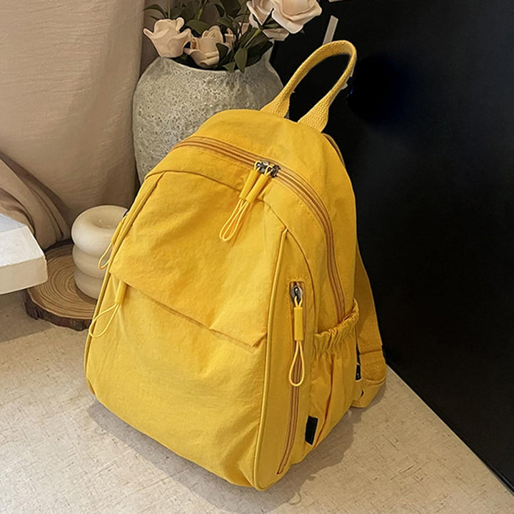 Arvion travel backpack, unisex waterproof design with multiple pockets, close-up of material