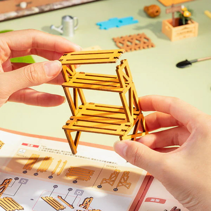 Handmade project: DIY miniature wooden garden house kit for creative hobbyists & home decor.