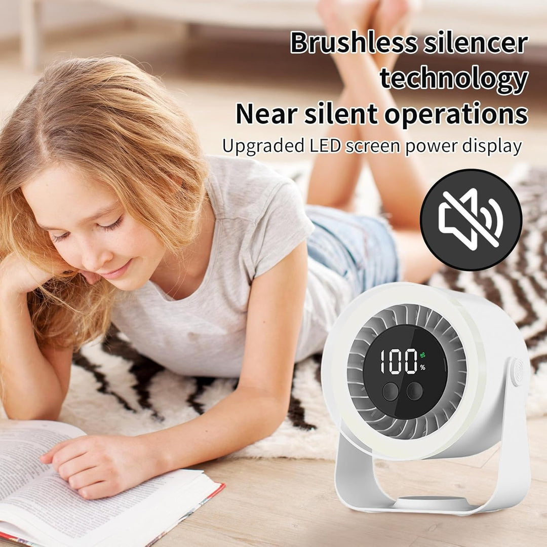 Auralis USB Rechargeable Quiet Desk Fan (black) with a laptop, showing its desk-friendly size.