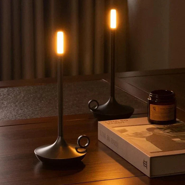 Aurelia modern table lamp in a living room setting, providing soft, ambient light.