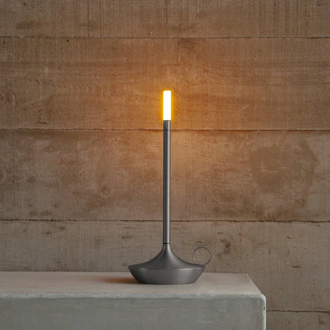 Rechargeable Aurelia LED table lamp featuring a sleek, modern aesthetic and dimmable light.