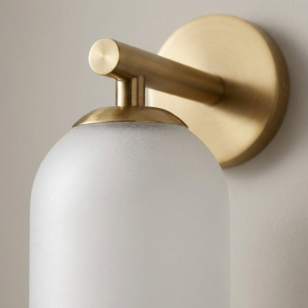 Sleek Aurelis vertical glass wall sconce casting soft, ambient light, ideal for contemporary spaces