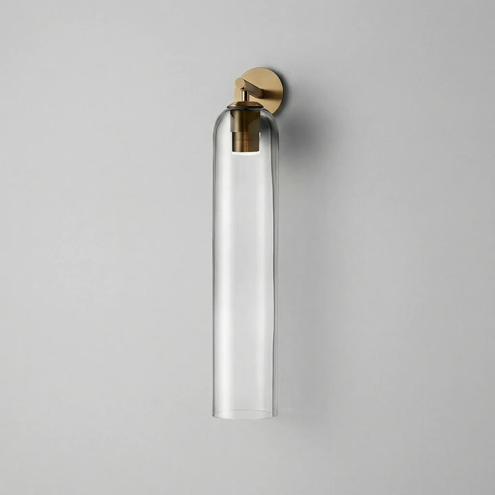 Close-up of Aurelis vertical glass wall sconce showcasing its modern design and diffused light effect