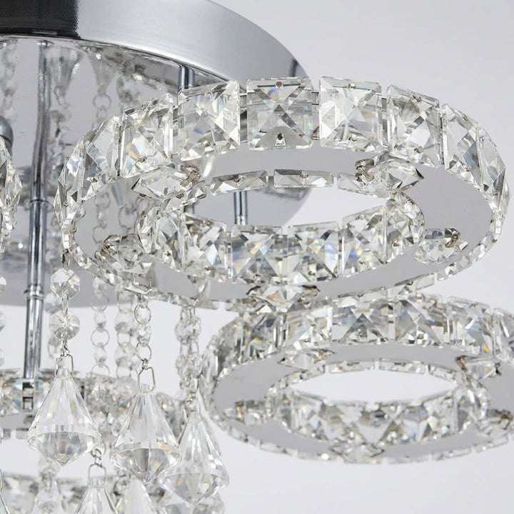 Close-up of Aurellin crystal chandelier, stainless steel frame, luxury lighting