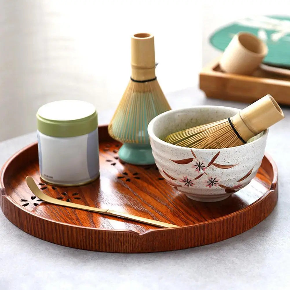 Authentic matcha tea ceremony set with bamboo whisk, bowl, and scoop for traditional green tea preparation.