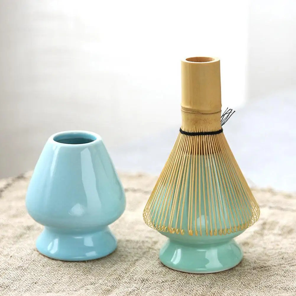 Complete matcha tea ceremony set featuring a natural bamboo whisk and essential green tea preparation tools.