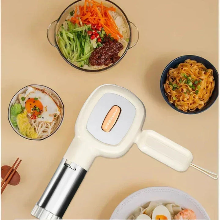 Creating fresh homemade pasta effortlessly with this automatic handheld noodle machine. Quick food prep solution.