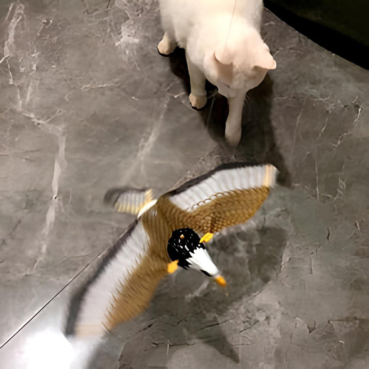 Close-up of the automatic bird cat toy in motion, engaging feline hunting instincts with realistic flight.