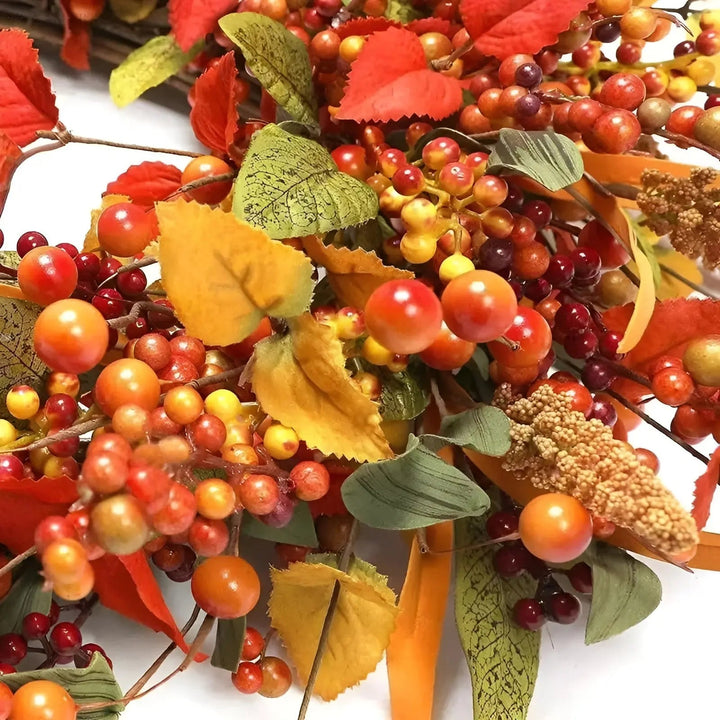 Handcrafted rattan door wreath adorned with colorful maple leaves, perfect fall home decor.