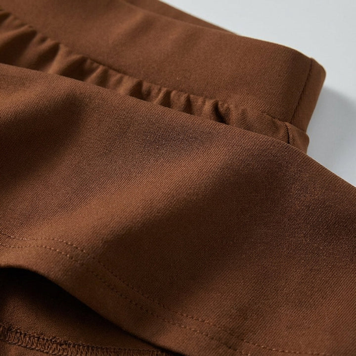 Close-up of Ava women's sporty mini skirt fabric, showing texture and built-in shorts detail.