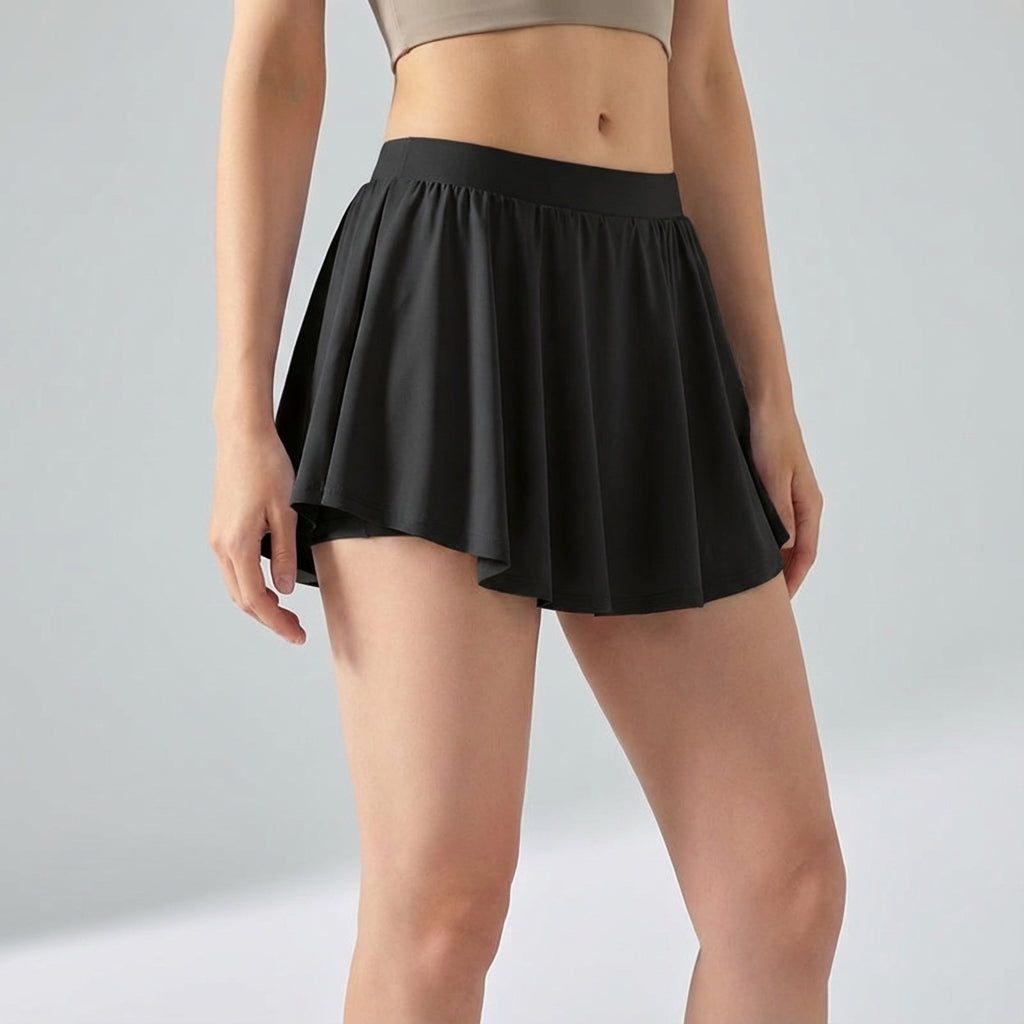 White Ava mini skort for women, designed for athletic activities and everyday casual wear.