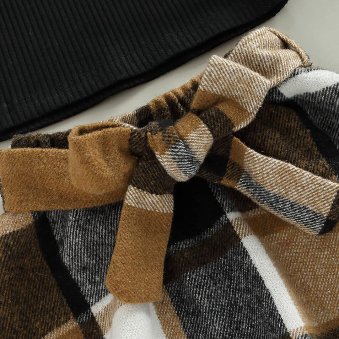 Close-up of the dress in the baby girls' knitted turtleneck winter set, showing the skirt's flair