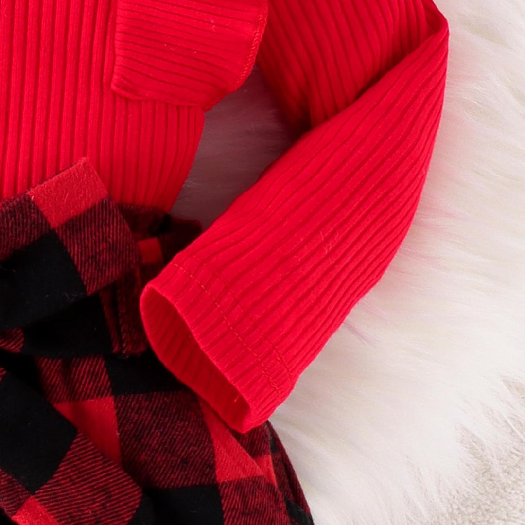 Pink knitted dress for baby girls, paired with a turtleneck as part of a complete winter outfit
