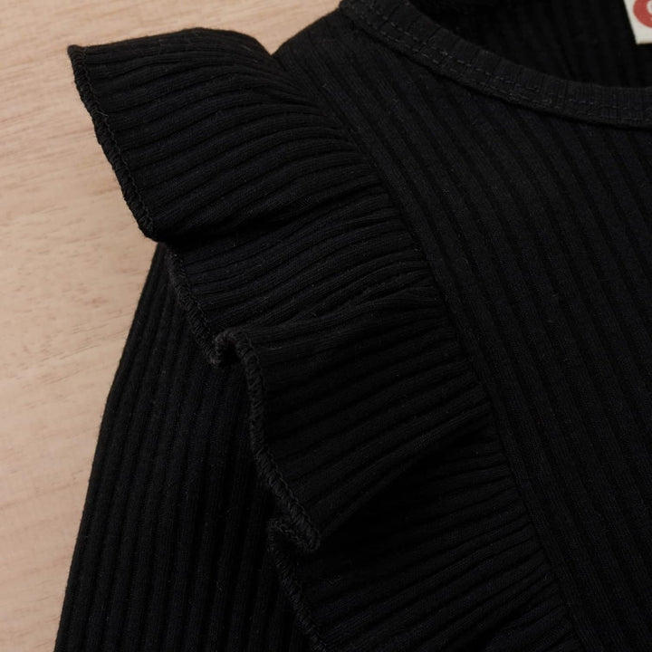 Comfortable pink knitted turtleneck for baby girls, complemented by an equally soft knitted dress