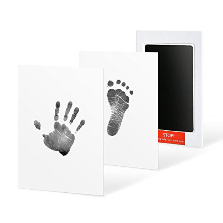 Delicate baby foot creating a beautiful imprint with the Mess-Free Footprint Kit, a memory gift.