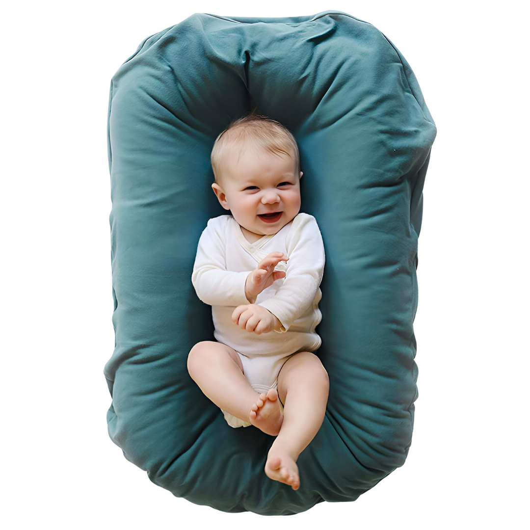 Baby lounger for safe sleep & cozy naps. Soft infant nest provides comfort & secure space for newborns.